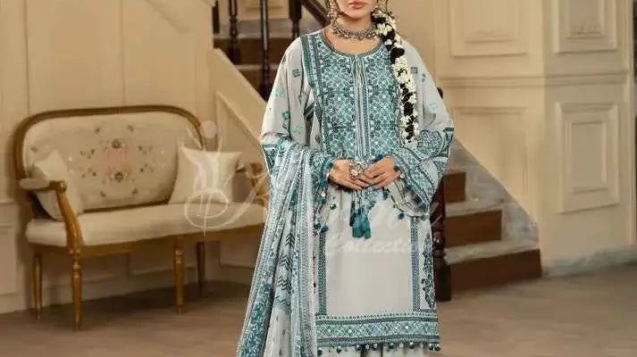 Woman in elegant attire showcasing Karma Collection party wear in a lavish indoor setting.