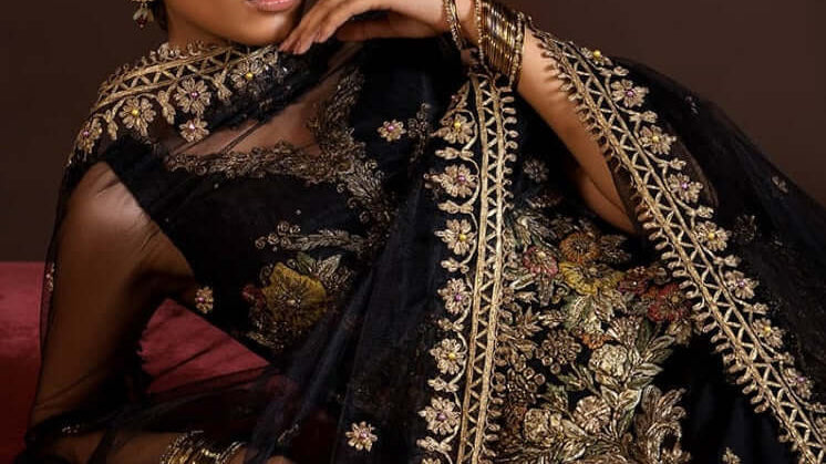 Khuda Baksh collection featuring an elegant black partywear outfit with exquisite embroidery.