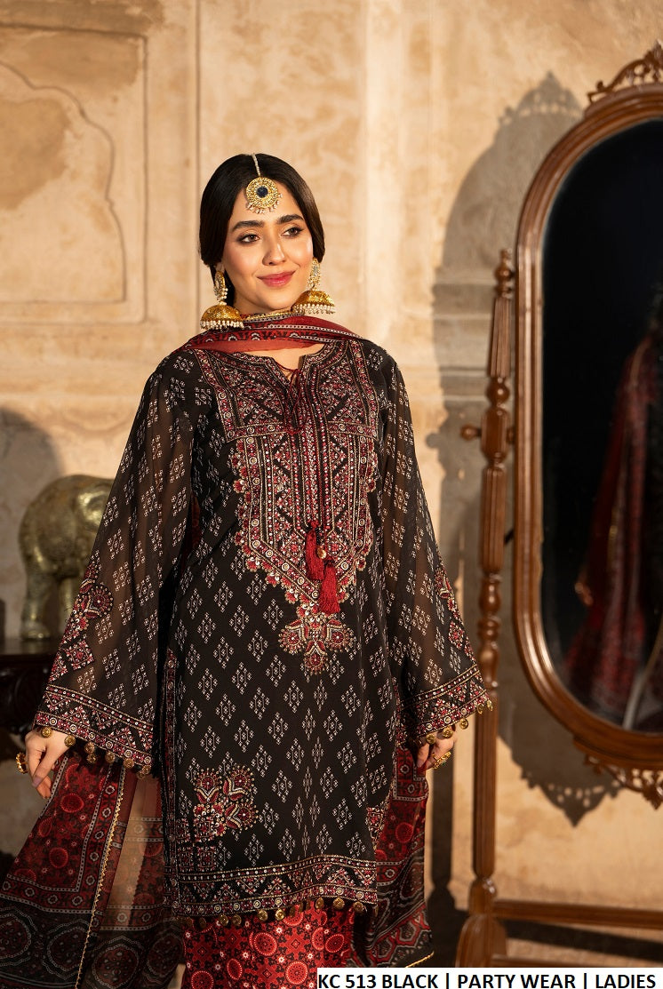 Ebony black sindhi balochi embroidered Pakistani women's short shirt with ajrak farshi shalwar side view