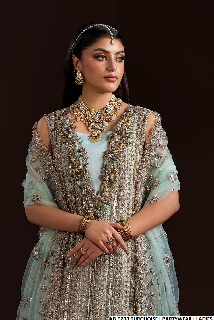 Pakistani women's turquoise hand embroidered luxury suit detail view