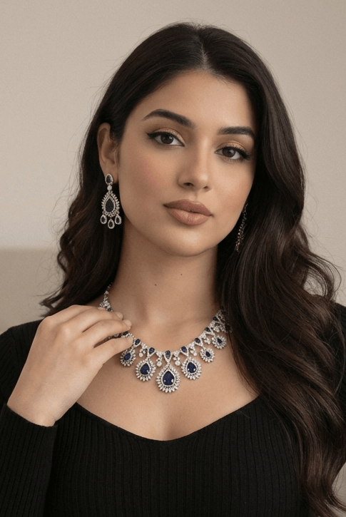 Royal sapphire sunburst necklace set - Pakistani women's luxury bridal jewelry with deep sapphire stones and zircon halos front view