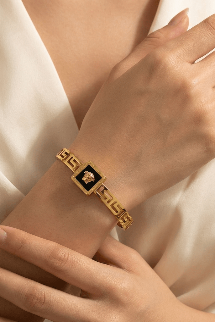 Luxury black dial gold statement bangle - Pakistani women's elegant jewelry with geometric link design and black dial front view