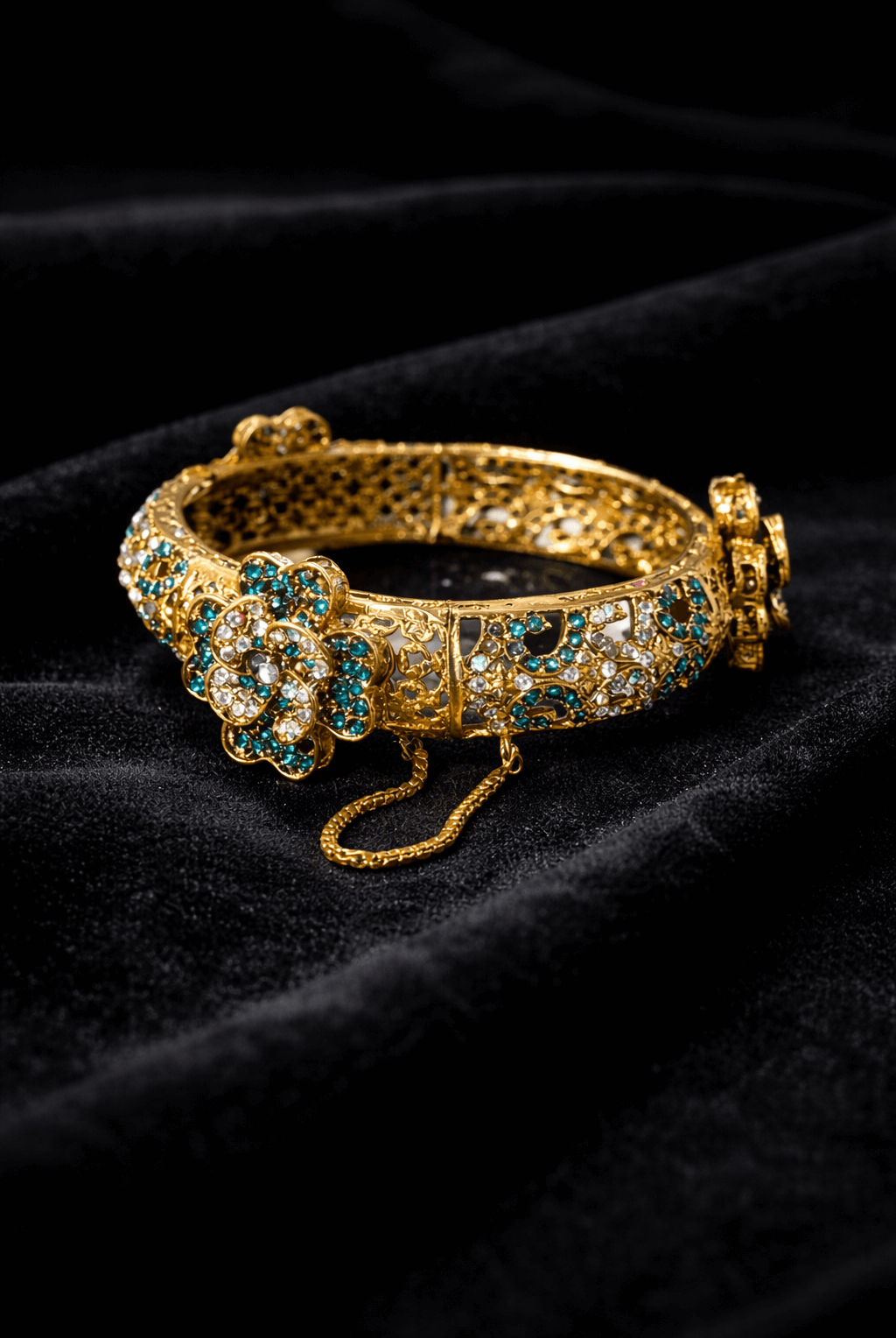 Royal emerald floral gold bangle - Pakistani women's luxury bridal jewelry with filigree detailing and emerald teal stones front view