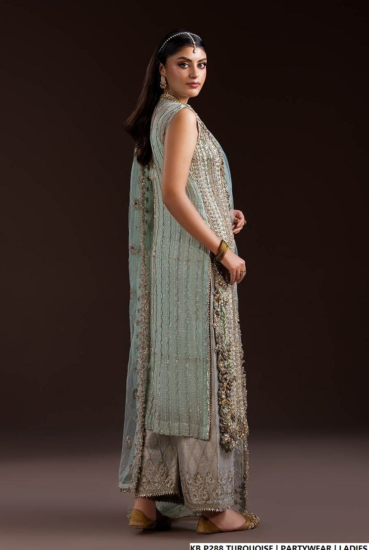 Pakistani women's turquoise hand embroidered luxury suit back view