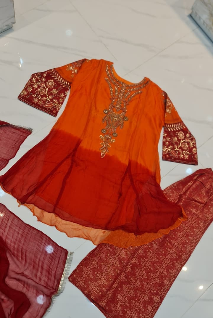 Pakistani women's orange chiffon frock plazo back view