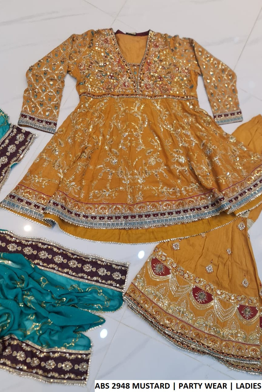 Mustard yellow chiffon Pakistani women's short frock with viscose gharara back view