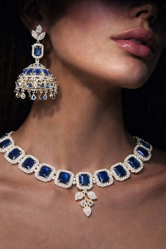 Royal sapphire jhumka set 1 carat - Pakistani women's luxury bridal jewelry with sapphire stones and jhumka earrings front view