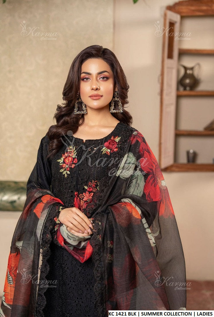 Authorized Karma distributor showcasing elegant black floral attire from the Summer Collection.