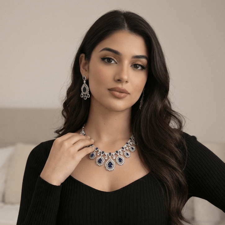 Royal sapphire sunburst necklace set - Pakistani women's luxury bridal jewelry with deep sapphire stones and zircon halos front view