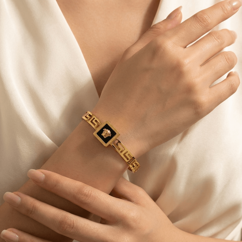 Luxury black dial gold statement bangle - Pakistani women's elegant jewelry with geometric link design and black dial front view