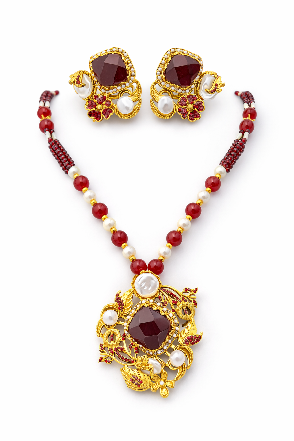 Ruby pearl royal necklace set - Pakistani women's luxury bridal jewelry with intricate gold tone craftsmanship and matching earrings front view