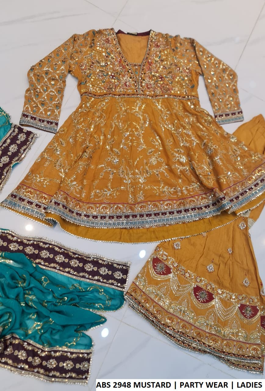 Mustard yellow chiffon Pakistani women's short frock with viscose gharara back view